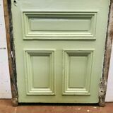 Service door with small tiles and 20th century glass impost