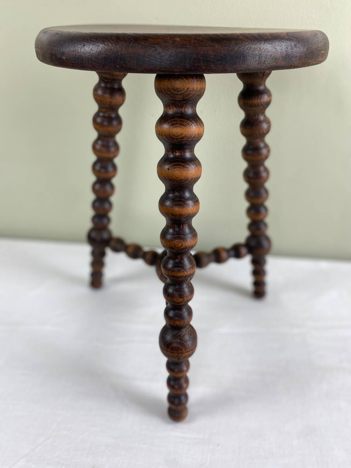 Signed turned wood tripod stool