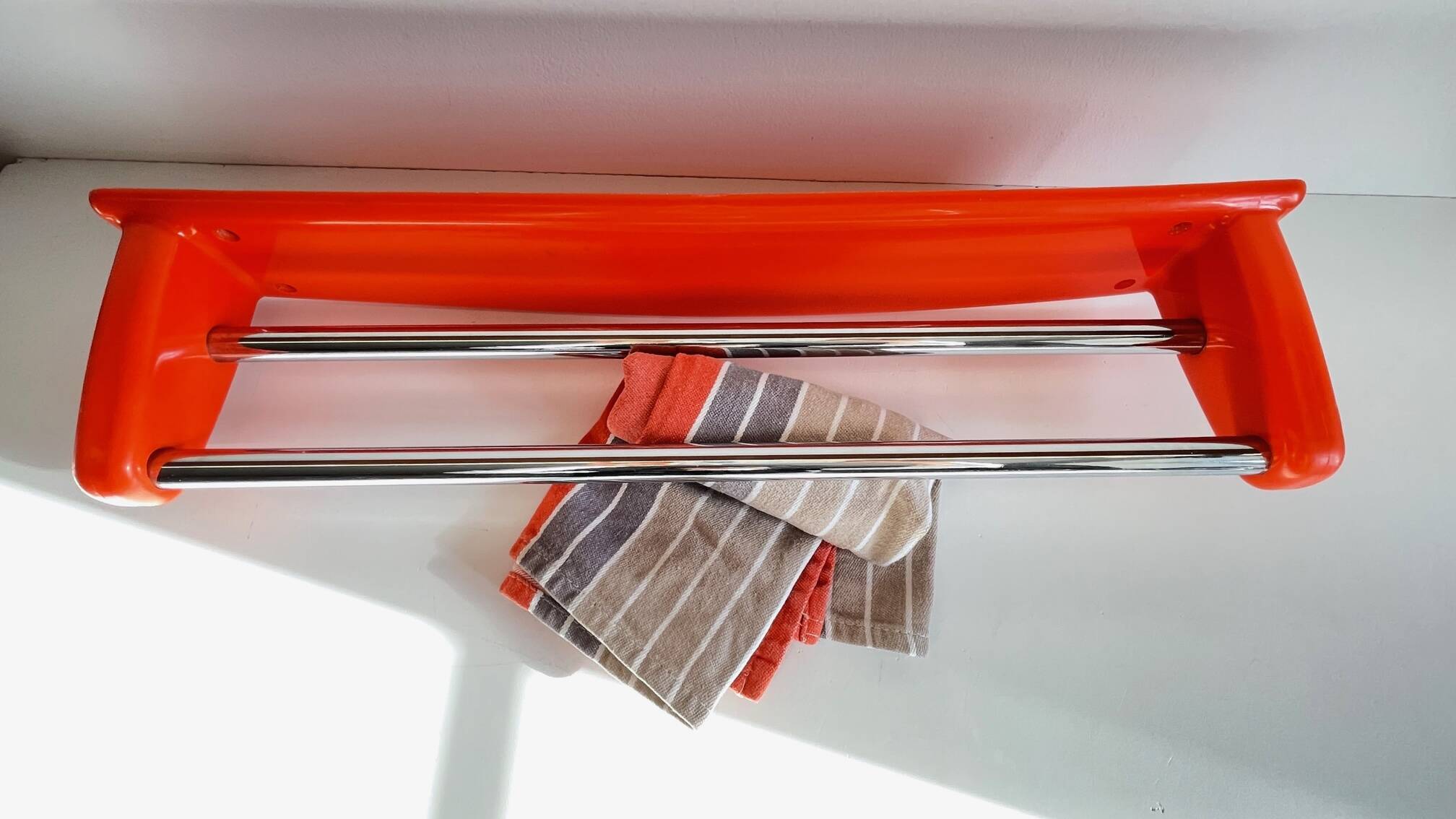 Orange towel rack by Syla from the 70s