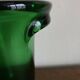 1950s Médicis vase, large Art Deco with handles, made of green blown glass.