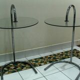 Two glass and metal bedside tables