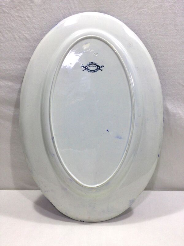 Plat ovale en faience modèle Flora Creil et Montereau