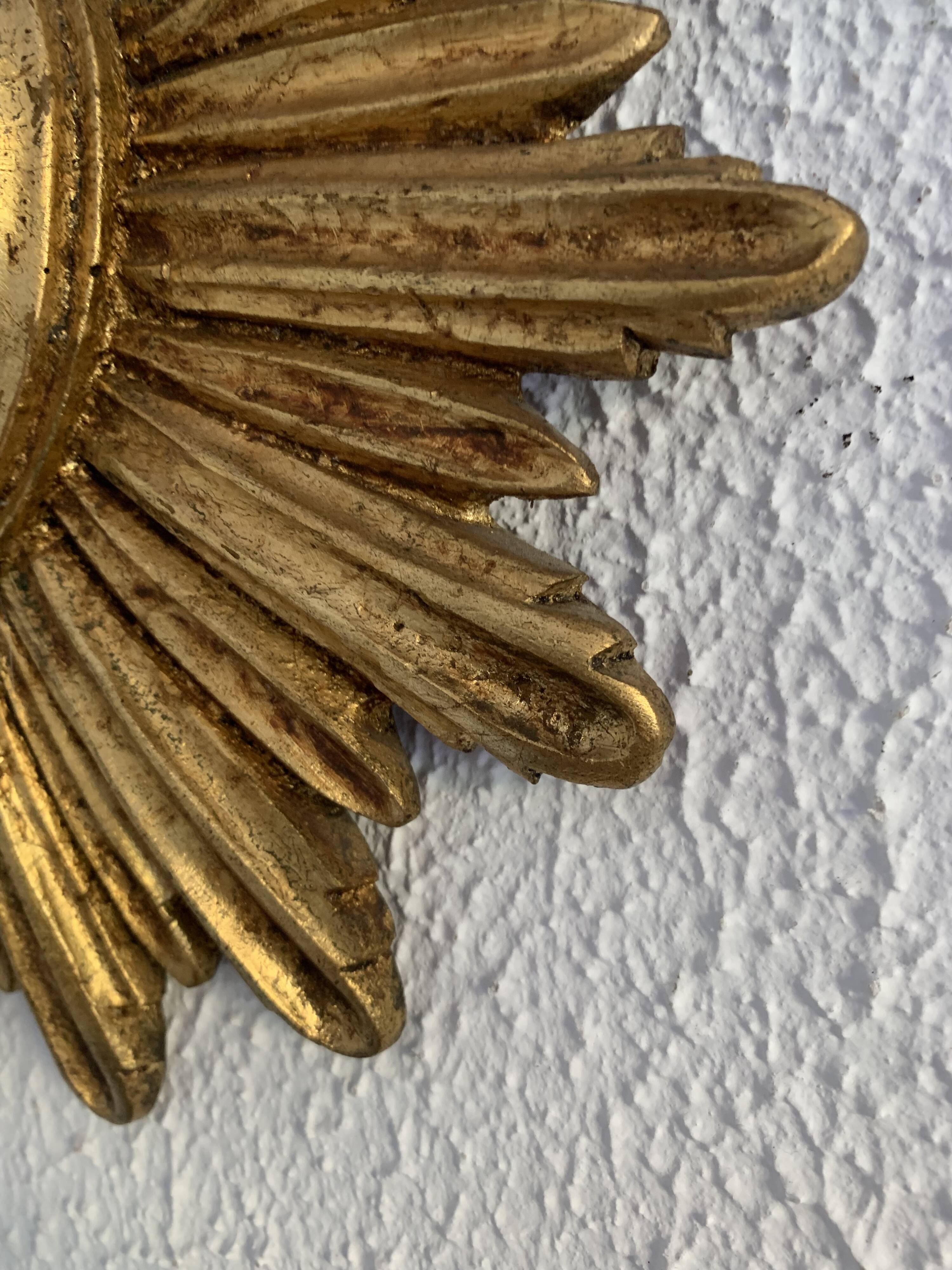 Vintage 1960s sunburst witch's eye mirror in gold - 27 cm