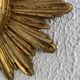 Vintage 1960s sunburst witch's eye mirror in gold - 27 cm