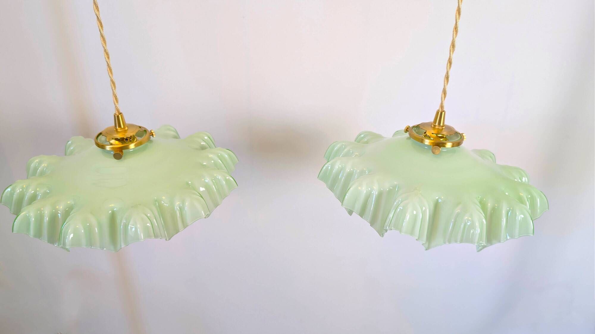 Pair of green opaline glass pendant lights – frosted poetry & Art Deco brilliance