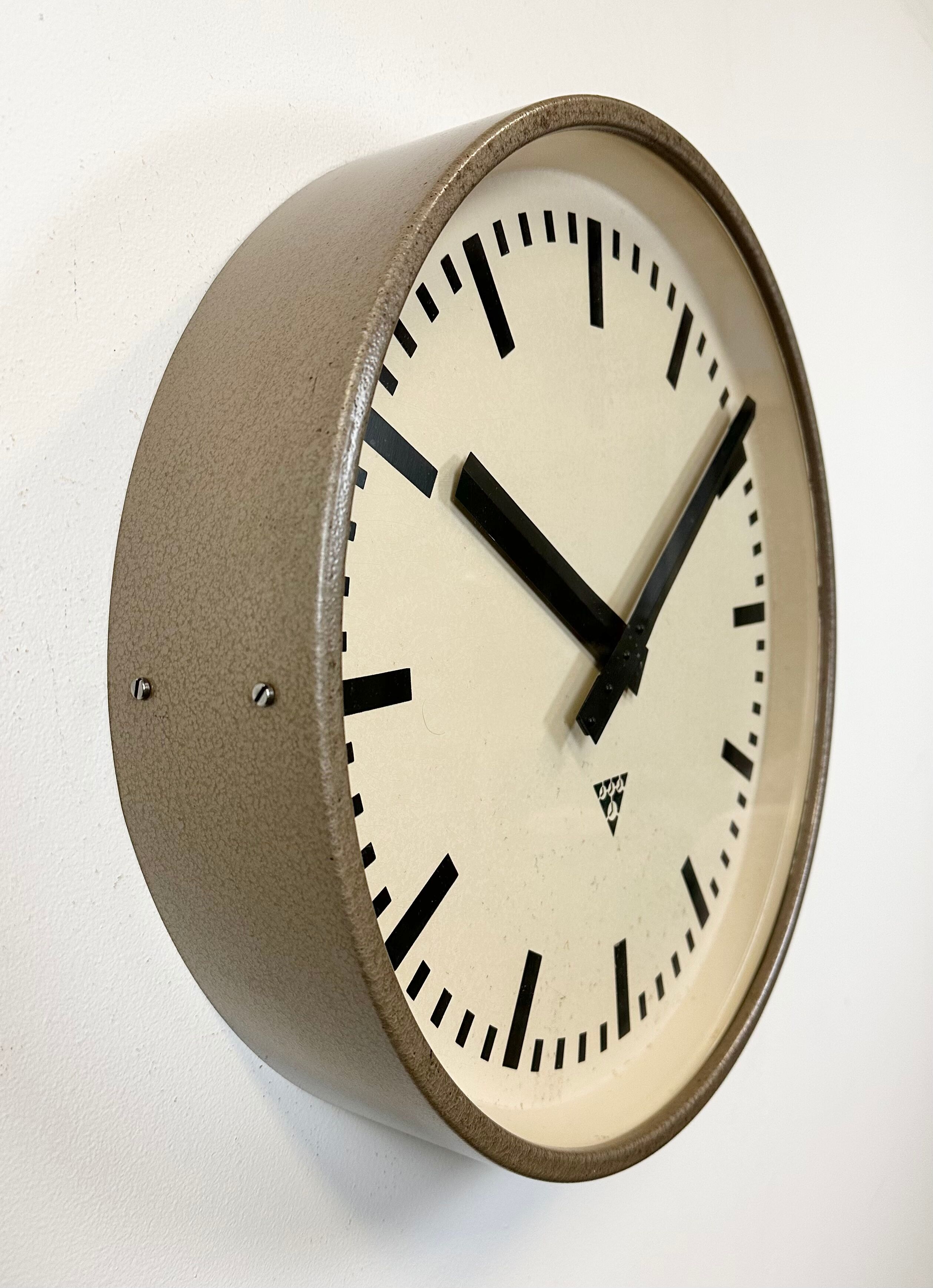 Brown industrial factory wall clock from Pragotron, 1960s