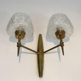 Pair of bronze sconces with worked glass reflectors