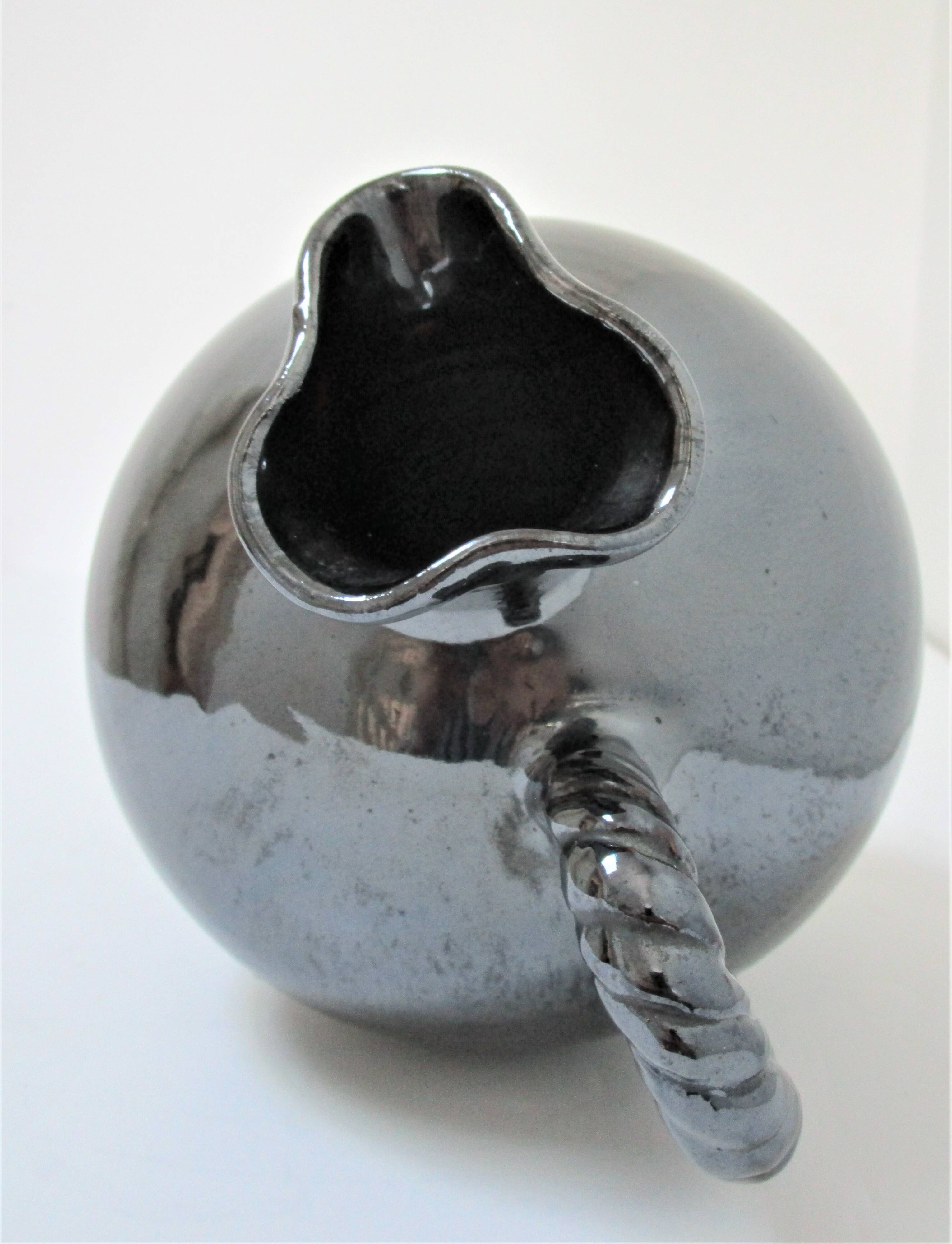 Black pearl glaze ceramic pitcher by Reinhold Rieckmann signed