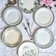 Old mismatched flat plates made of ironstone earthenware.