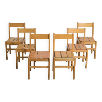 Set of six solid pine chairs by Maison Regain.