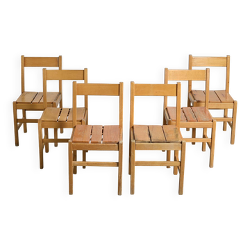 Set of six solid pine chairs by Maison Regain.