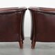 Set of two cow leather club armchairs in a luxurious red/brown colour