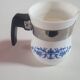 white ceramic milk jug with blue flowers, metal handle