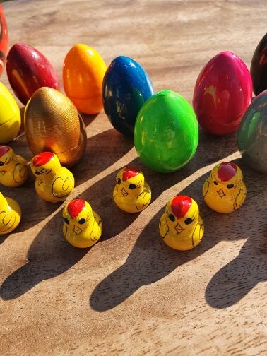 Chicken with eggs and chicks
