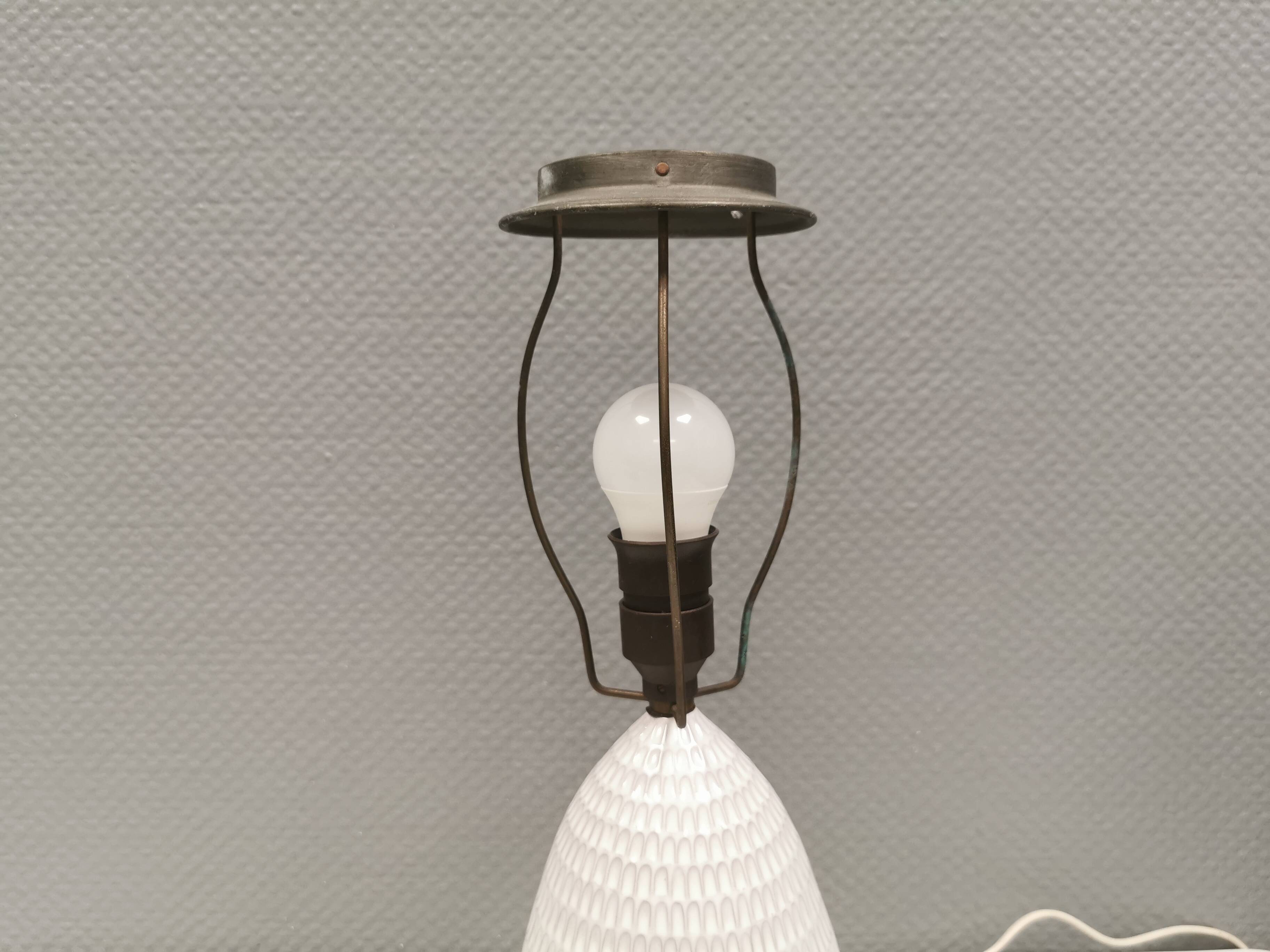 Older ceramic table lamp with beautiful details.