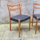 Pair of Scandinavian style chairs in wood and faux leather.
