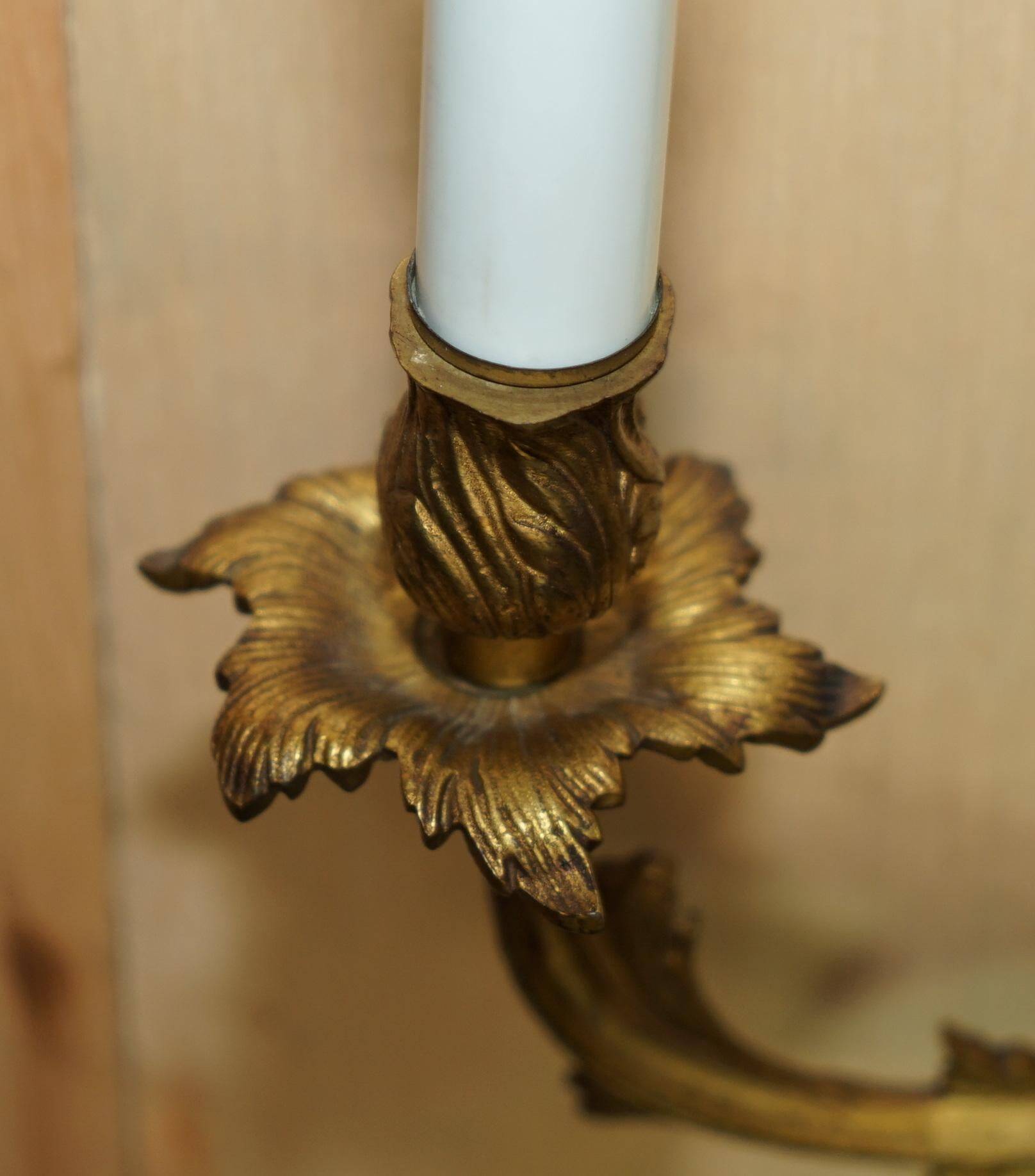 Pair of antique French wall sconces, gilded and bronzed, from the 1920s.