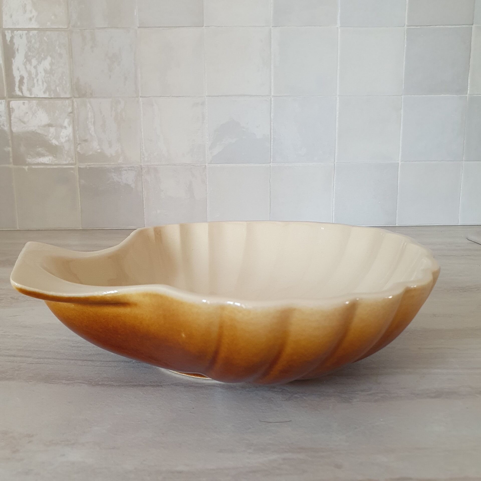 Brown and white ceramic shell bowl