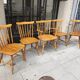 Four chairs and a Heywood Wakefield Windsor armchair. Vintage