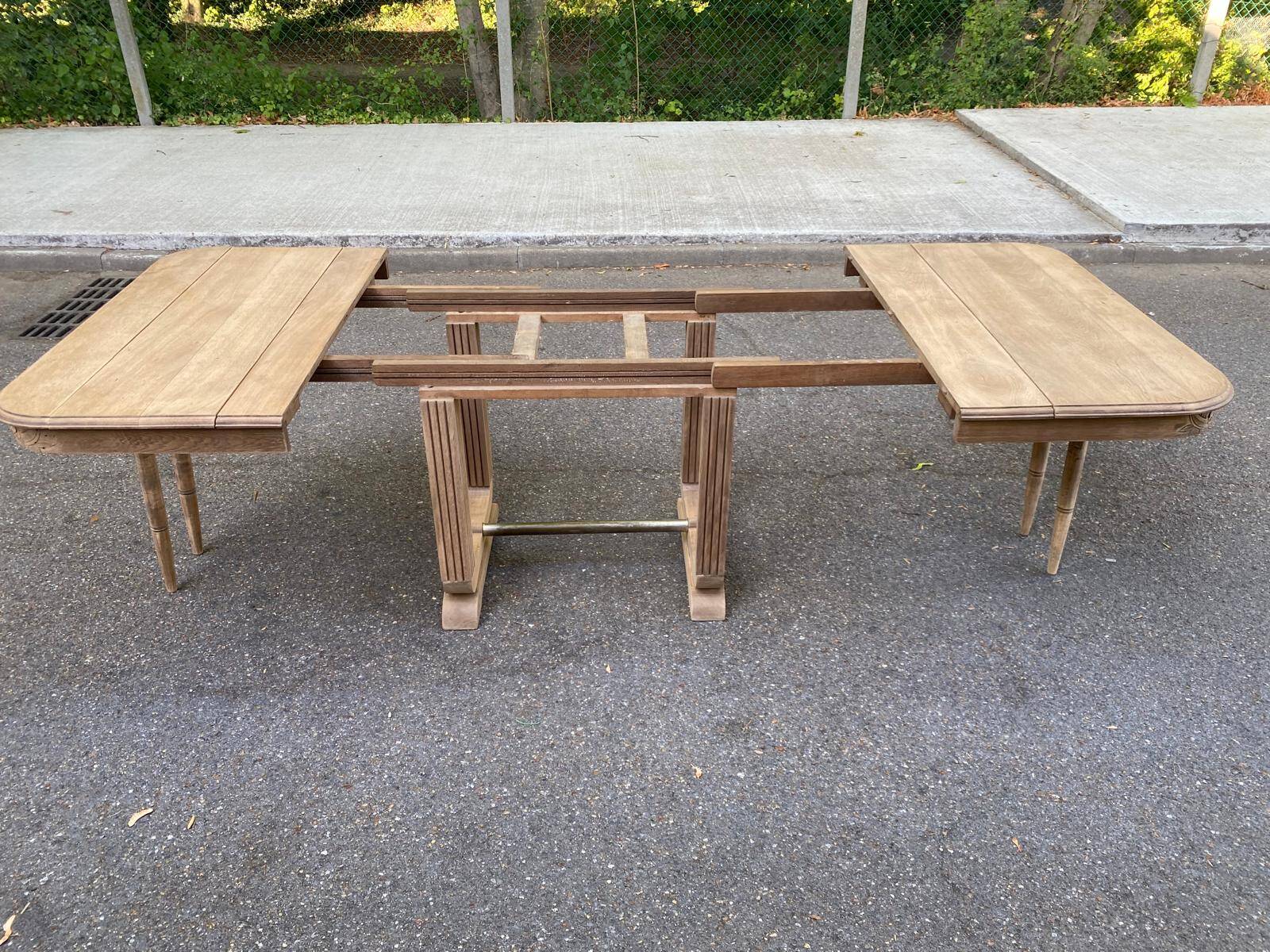 Rectangular Art Deco dining table with a central pedestal, stripped in solid oak.