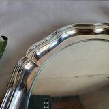 Round silver-plated serving dish with a glass base.