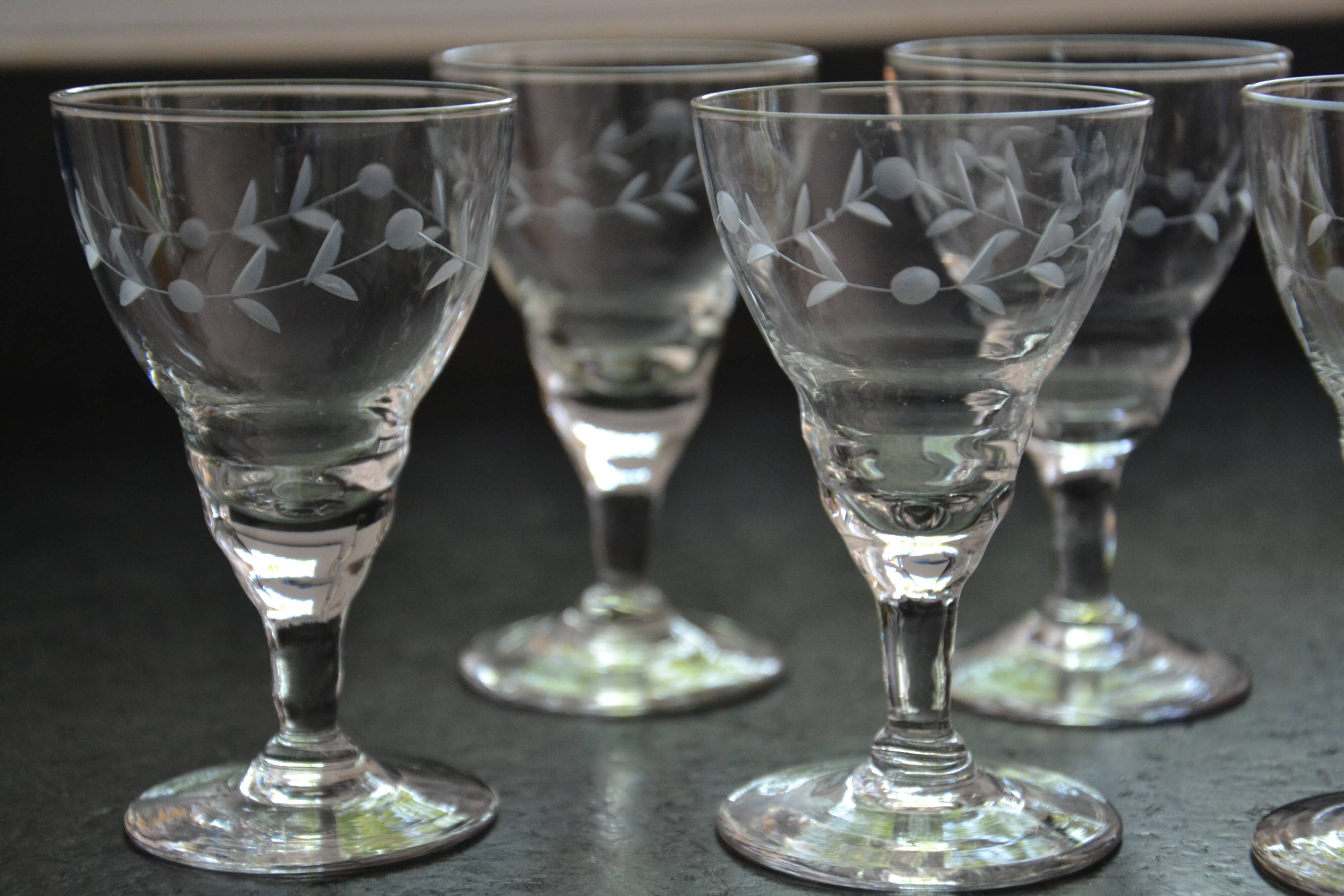 8 small old chiseled glasses