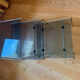 Nest of coffee tables in glass and metal.