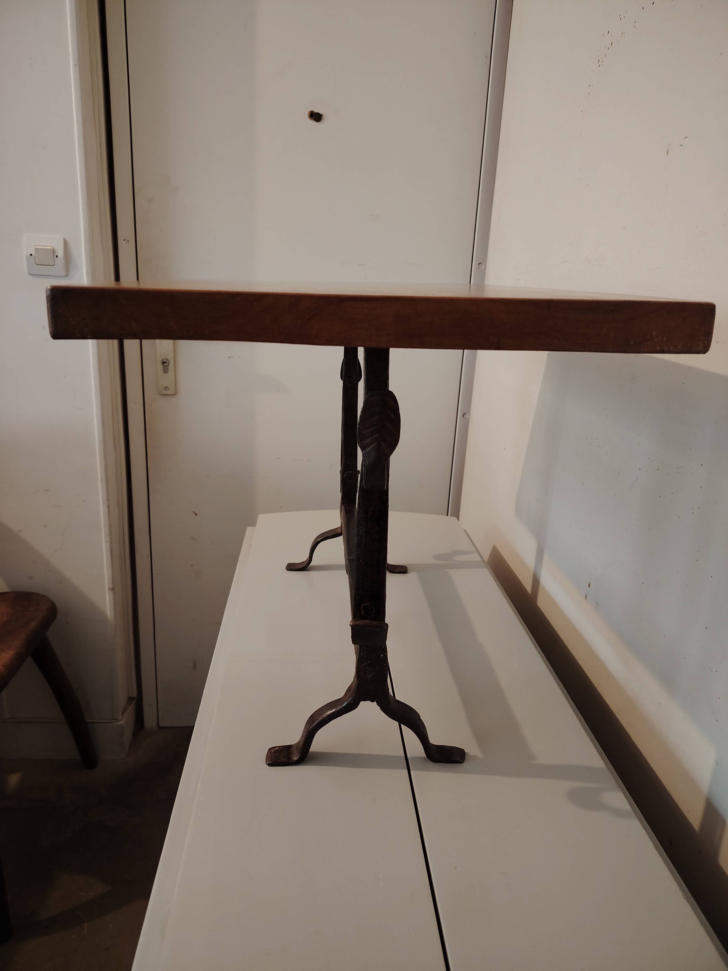 Solid wood and wrought iron coffee table