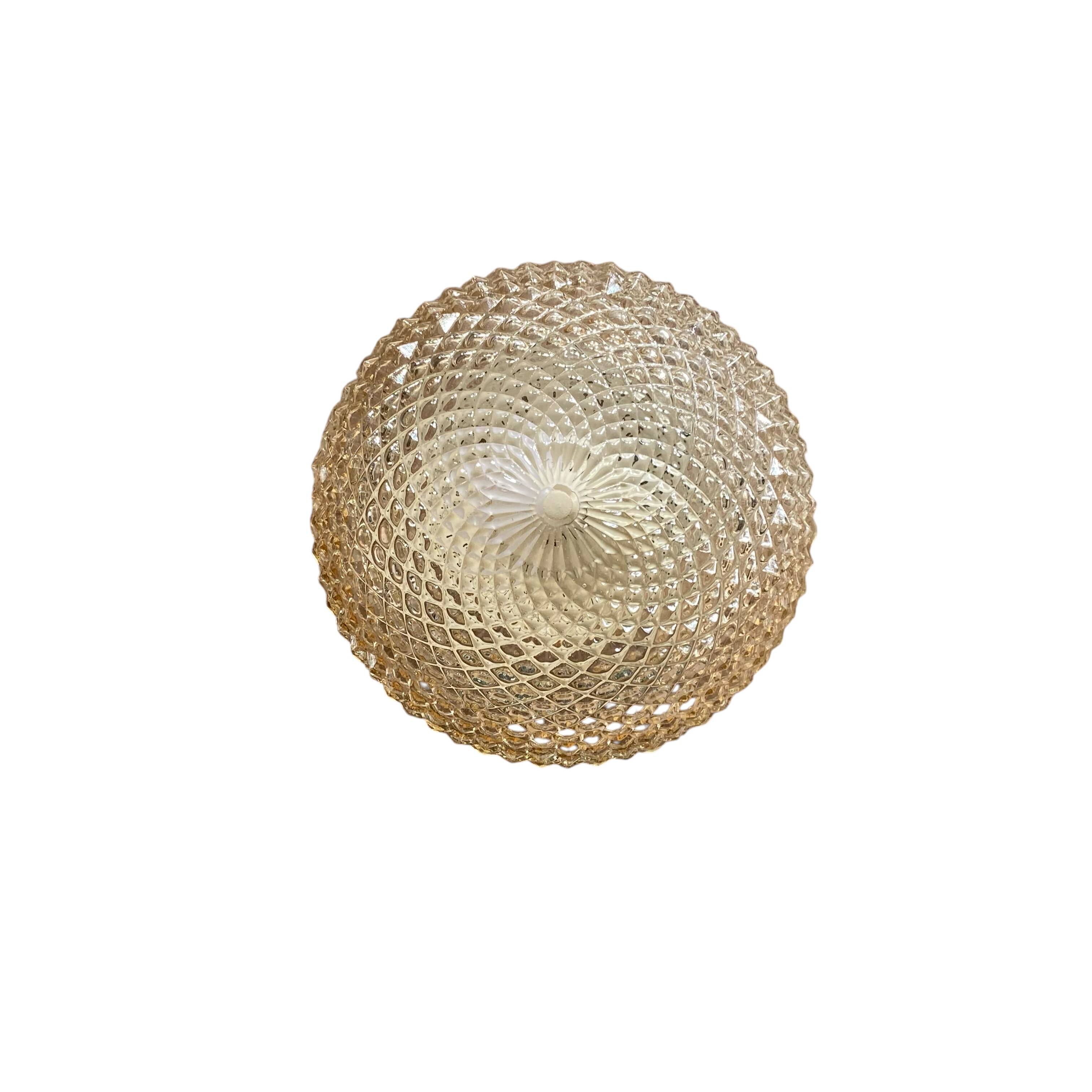 Amber glass wall light or ceiling light with a diamond tip.
