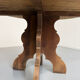 Round table in solid wood, thick top, vintage brutalist style from the 1960s.