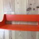 Space age wall coat rack, orange wood, with its shelf from the 1970s.