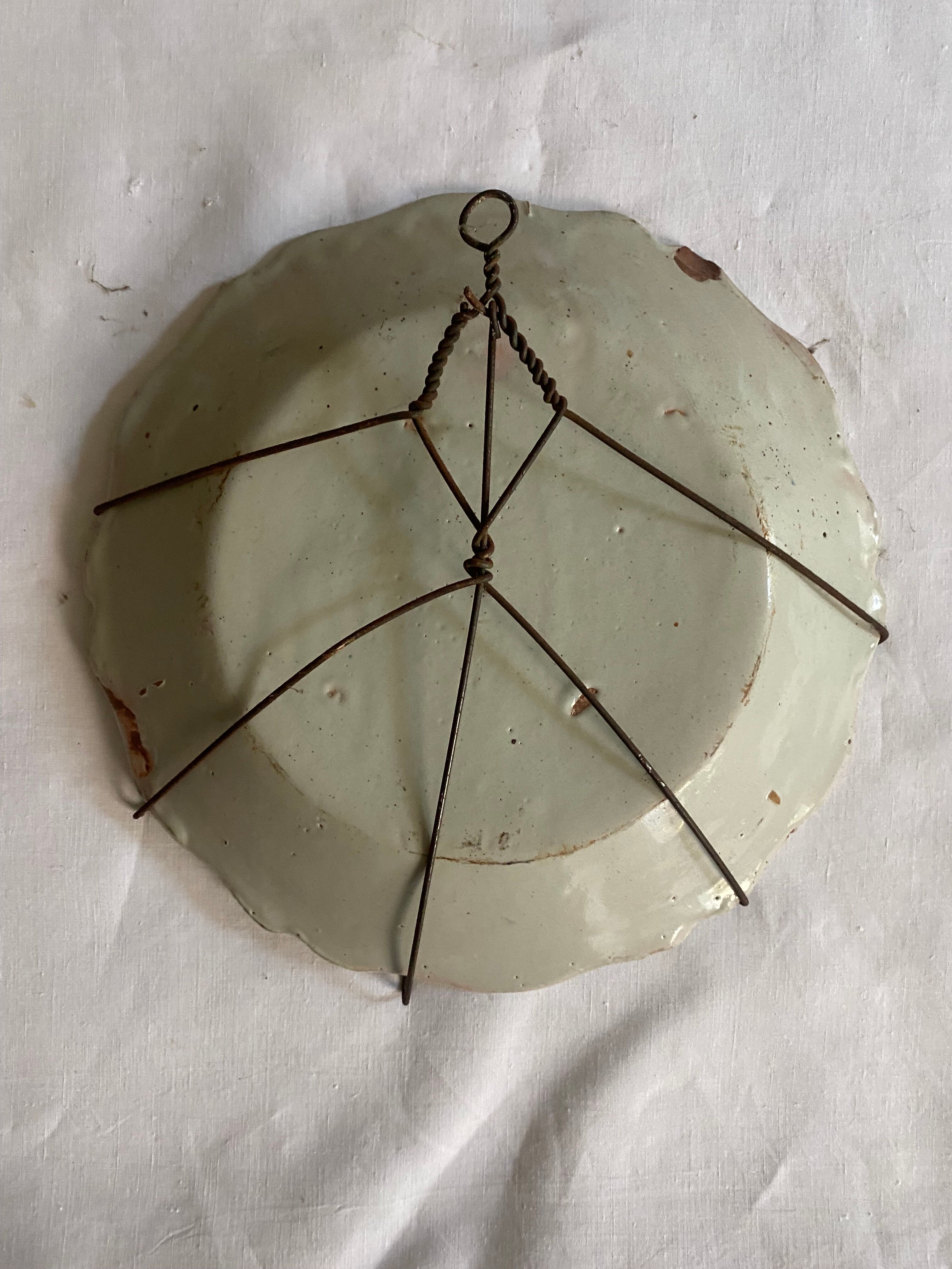 Plate of Nevers in earthenware late eighteenth century floral decoration