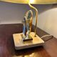 Brass lamp in the shape of a fish by Somchai Hattakitkosol.