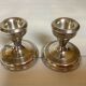 Pair of small silver candlesticks with hallmarks
