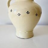 Vintage butter yellow ceramic pitcher in rustic style