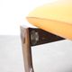 Vintage German sculptural chair from the 1970s in wood with orange faux leather.