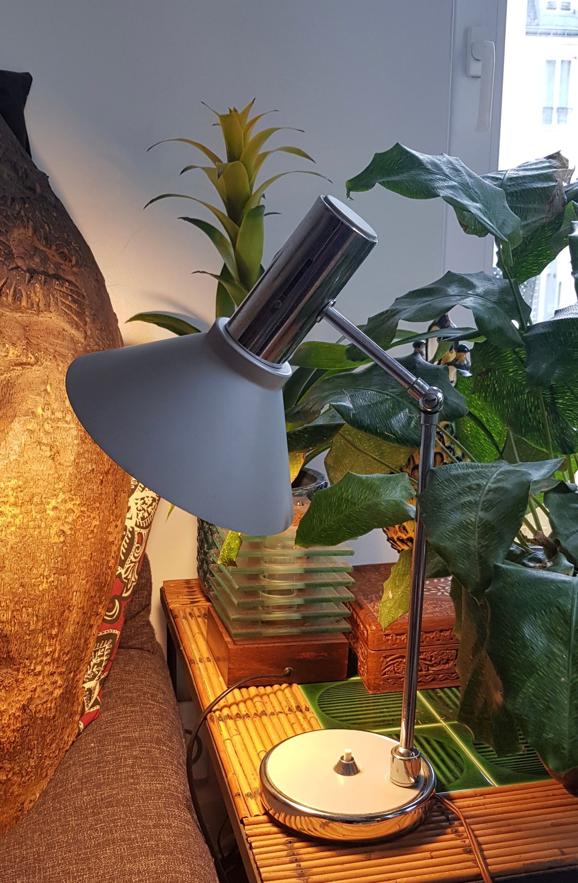 Chrome metal desk lamp and gray articulated arm