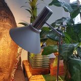 Chrome metal desk lamp and gray articulated arm