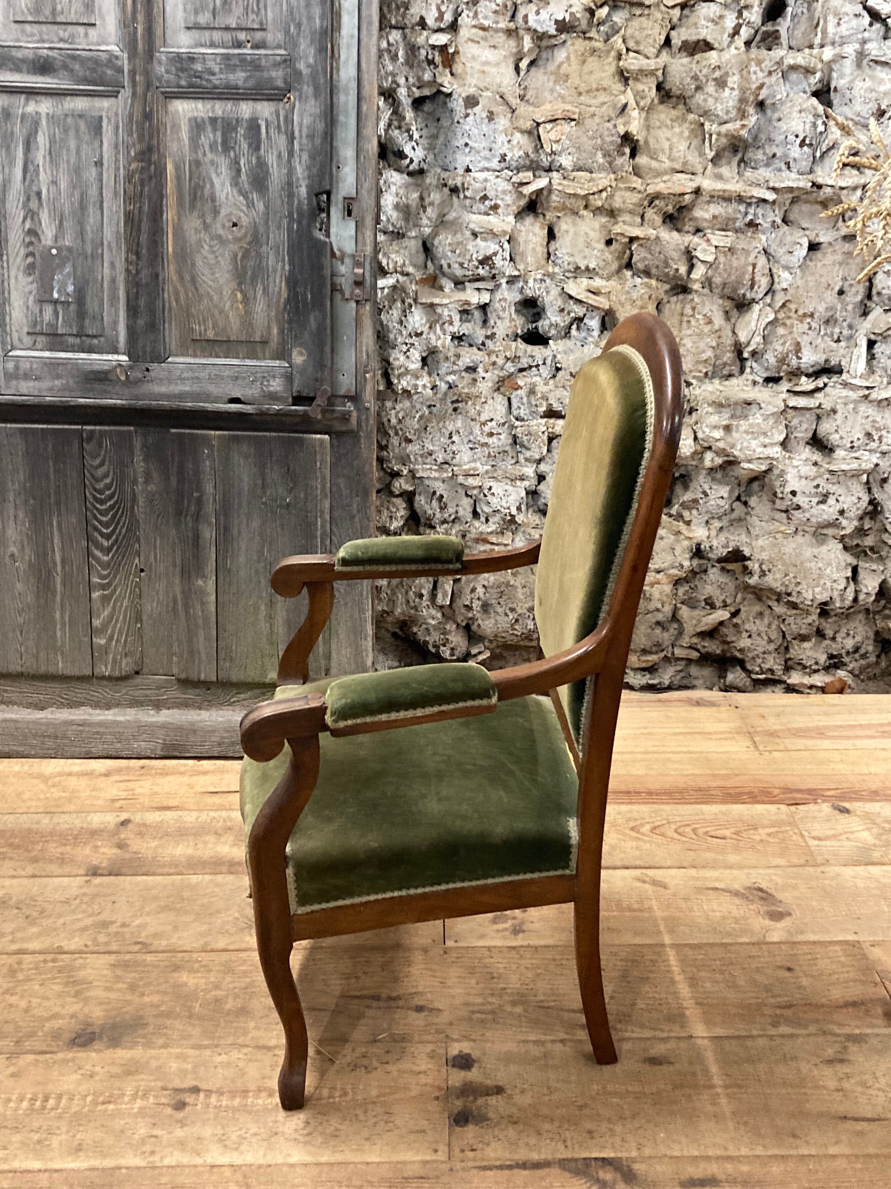 Antique Voltaire armchair in wood and green velvet Louis Philippe