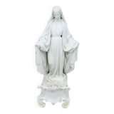 Ancient statuette of the virgin with the serpent in biscuit