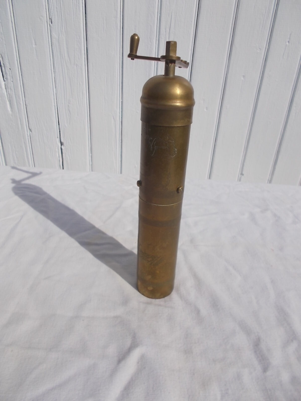 Oriental brass pepper mill