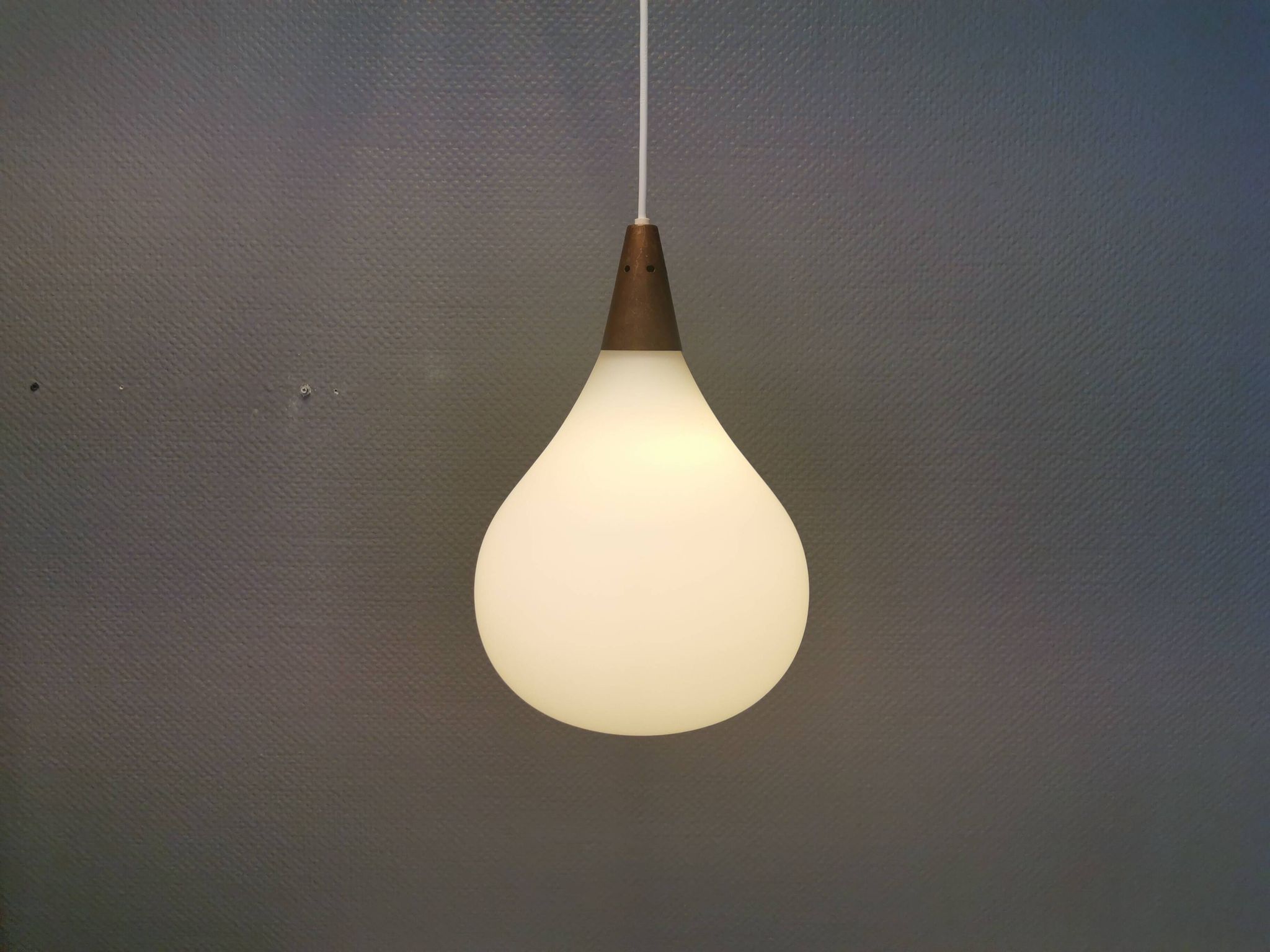 Large hanging lamp in white opal glass with brass top. Danish and estimated from the 1970s.