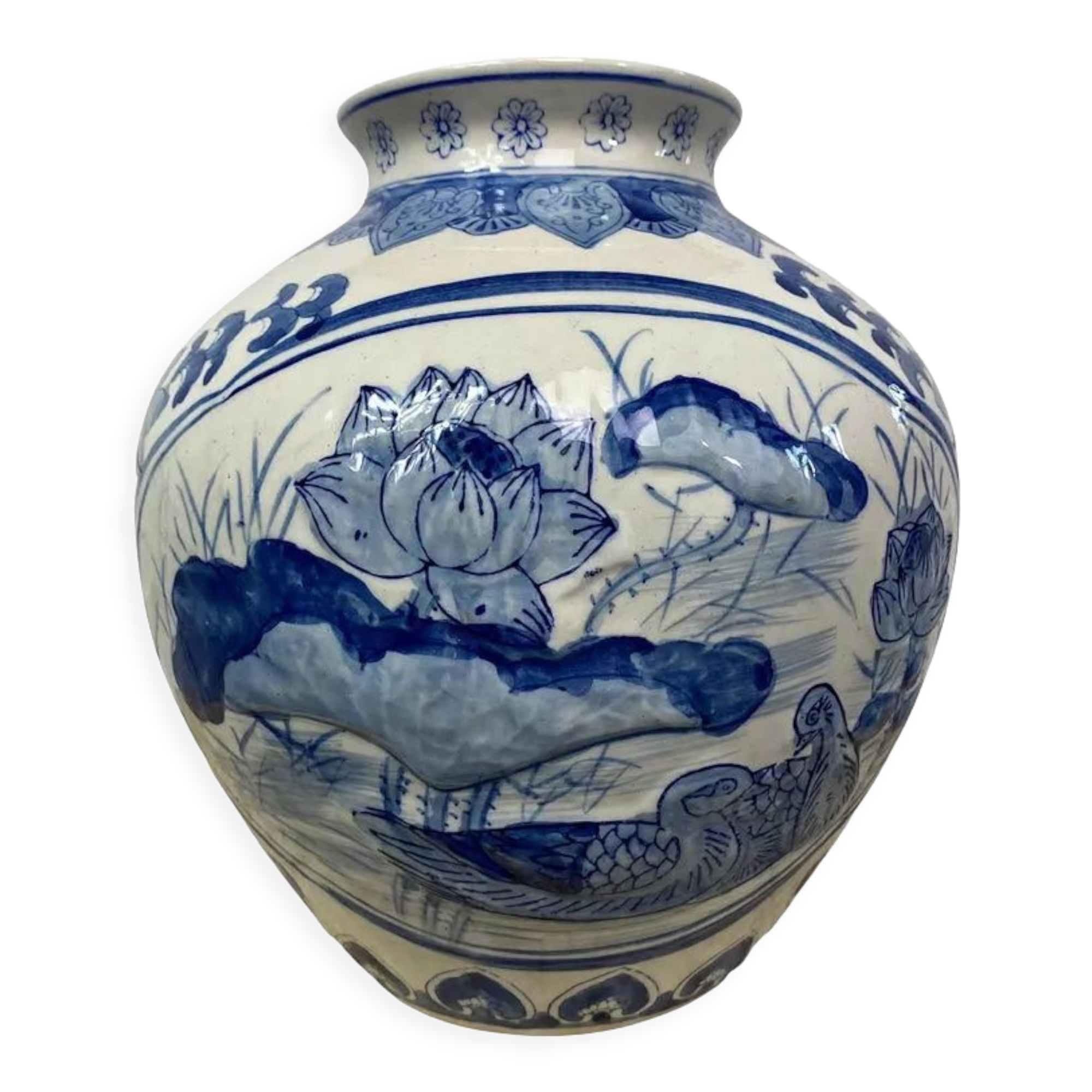 Chinese vase in blue-white porcelain decorated with lotus flowers