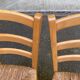 2 solid wood kitchen chairs with straw in a country style