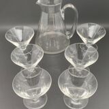 Glass and carafe set with chiseled flower motif