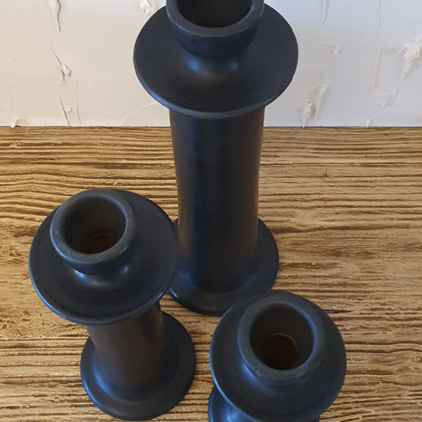 Set of three candlesticks in black tadelakt