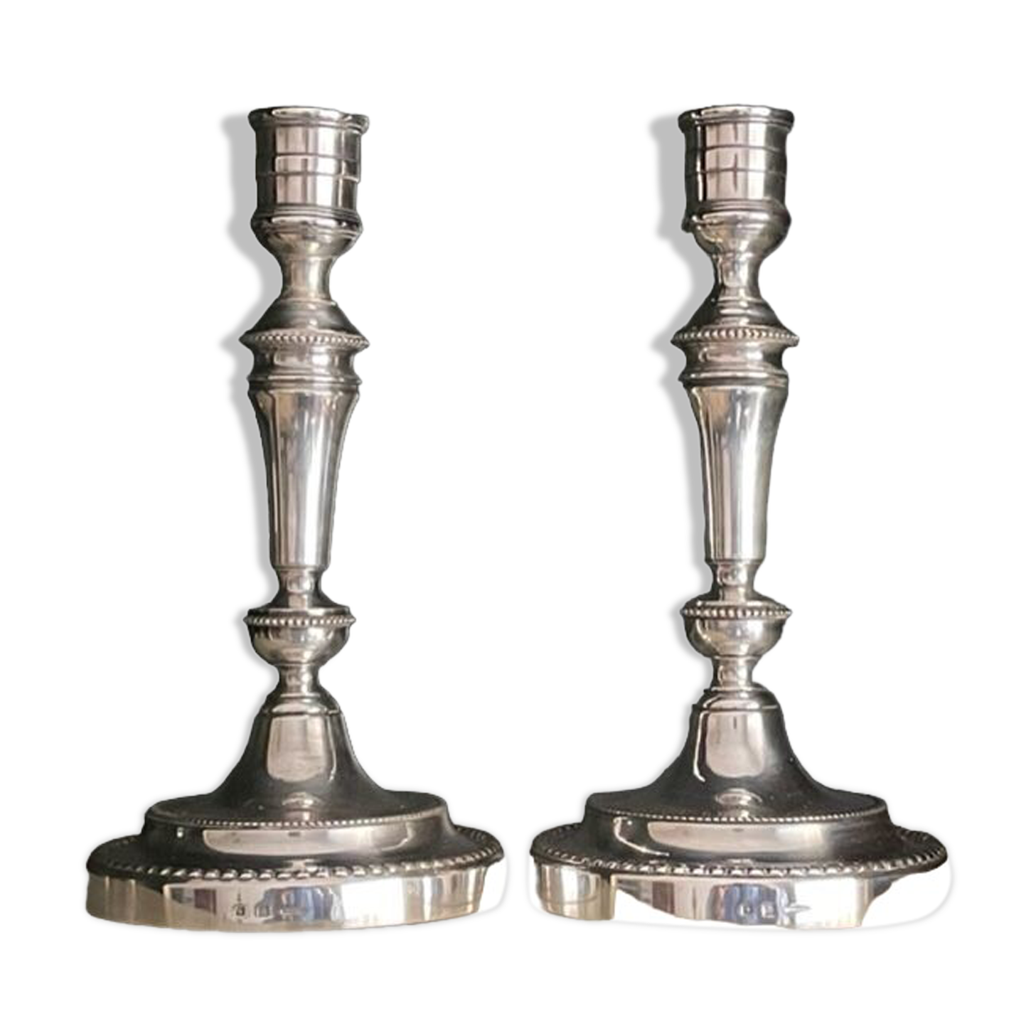 Pair of Christofle silver metal candle holders.