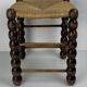 Brutalist wood turned bobbin rush stool in the style of Charles Dudouyt