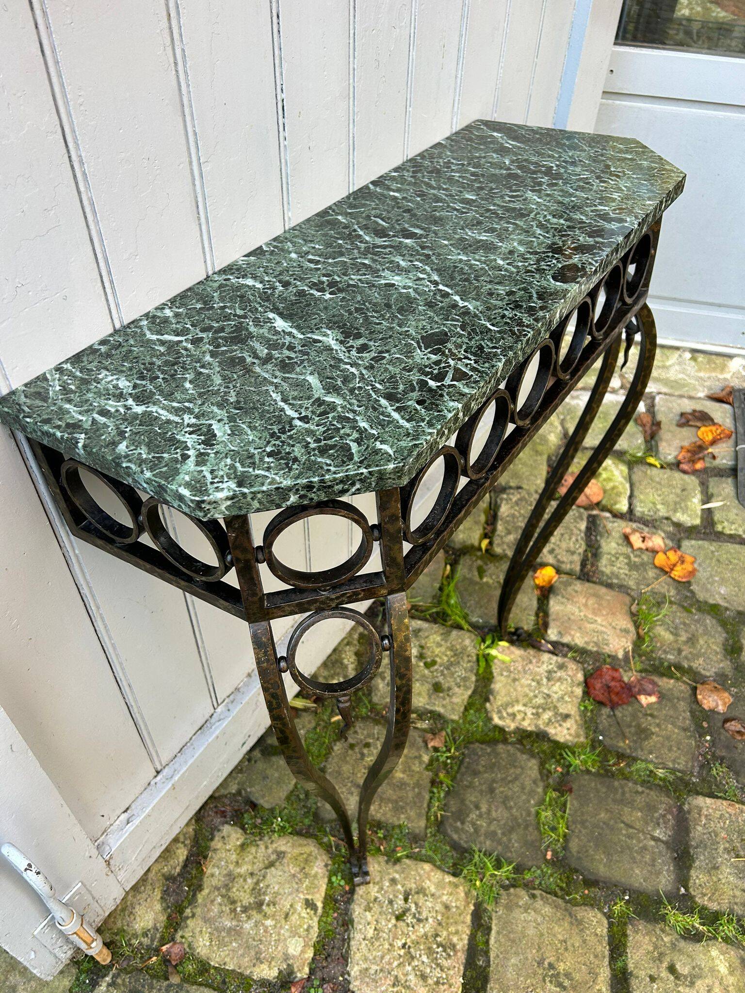Console in wrought and hammered iron and green marble