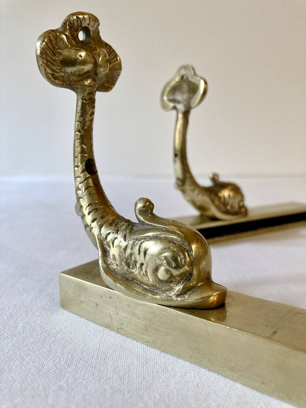 Brass wall supports for bathroom shelf, circa 1950.